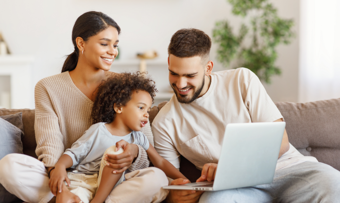 happy family on computer at home